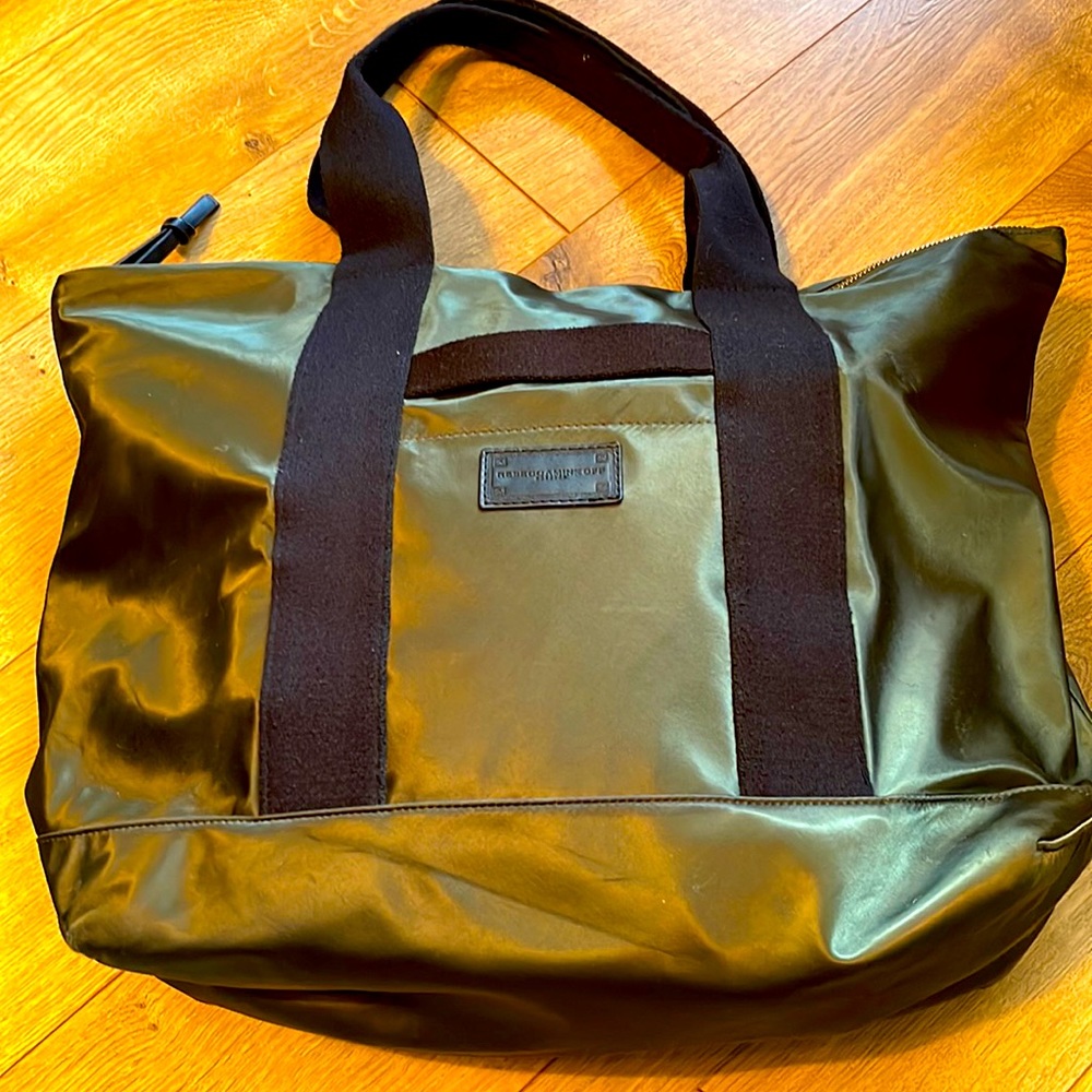 Rebecca Minkoff Satin tote with exterior phone pocket and zip top.